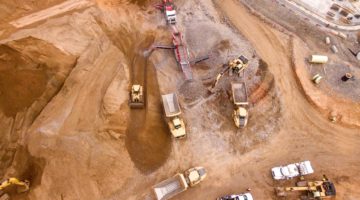 Mining trucks at excavation site